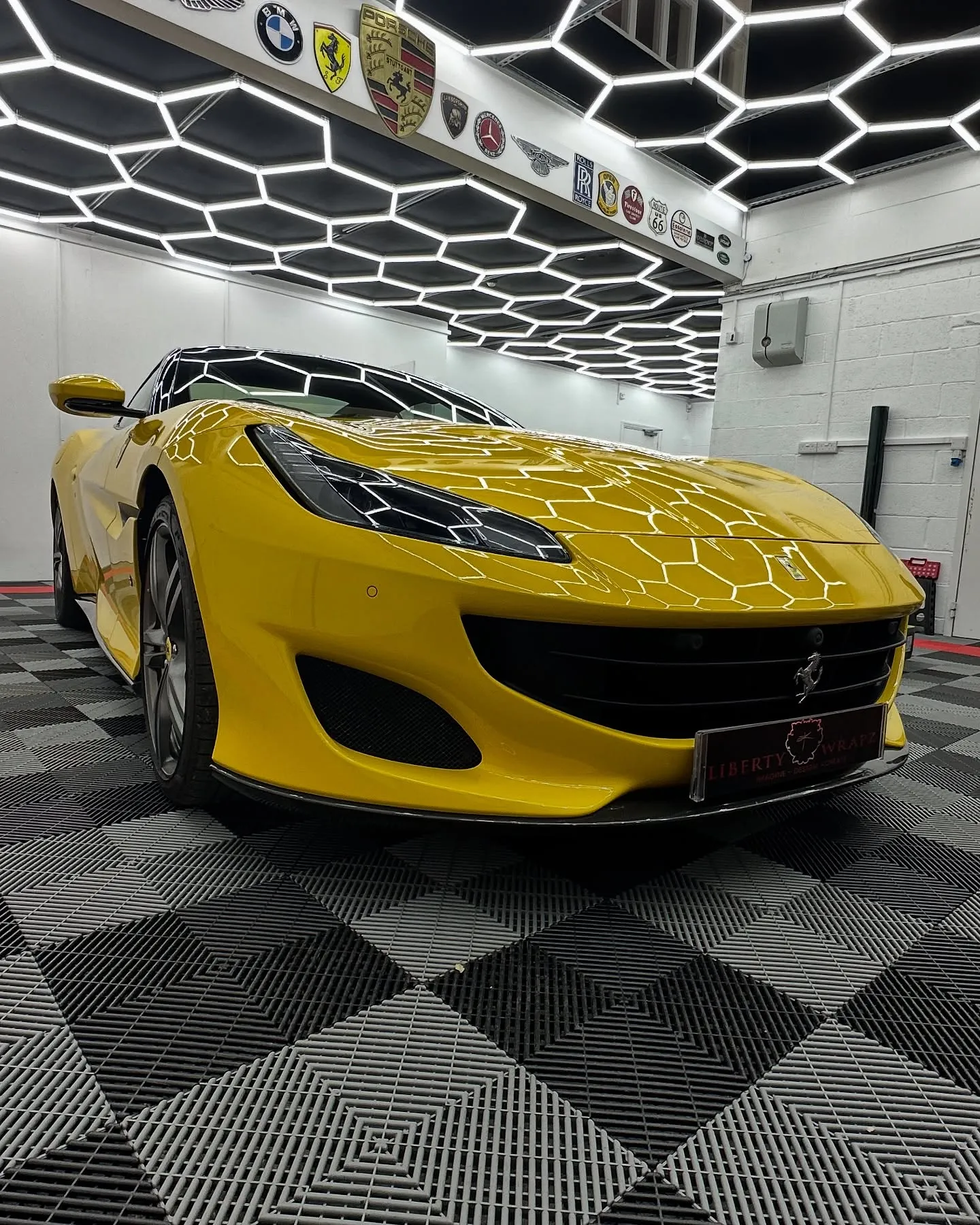 Front side view of yellow Ferrari