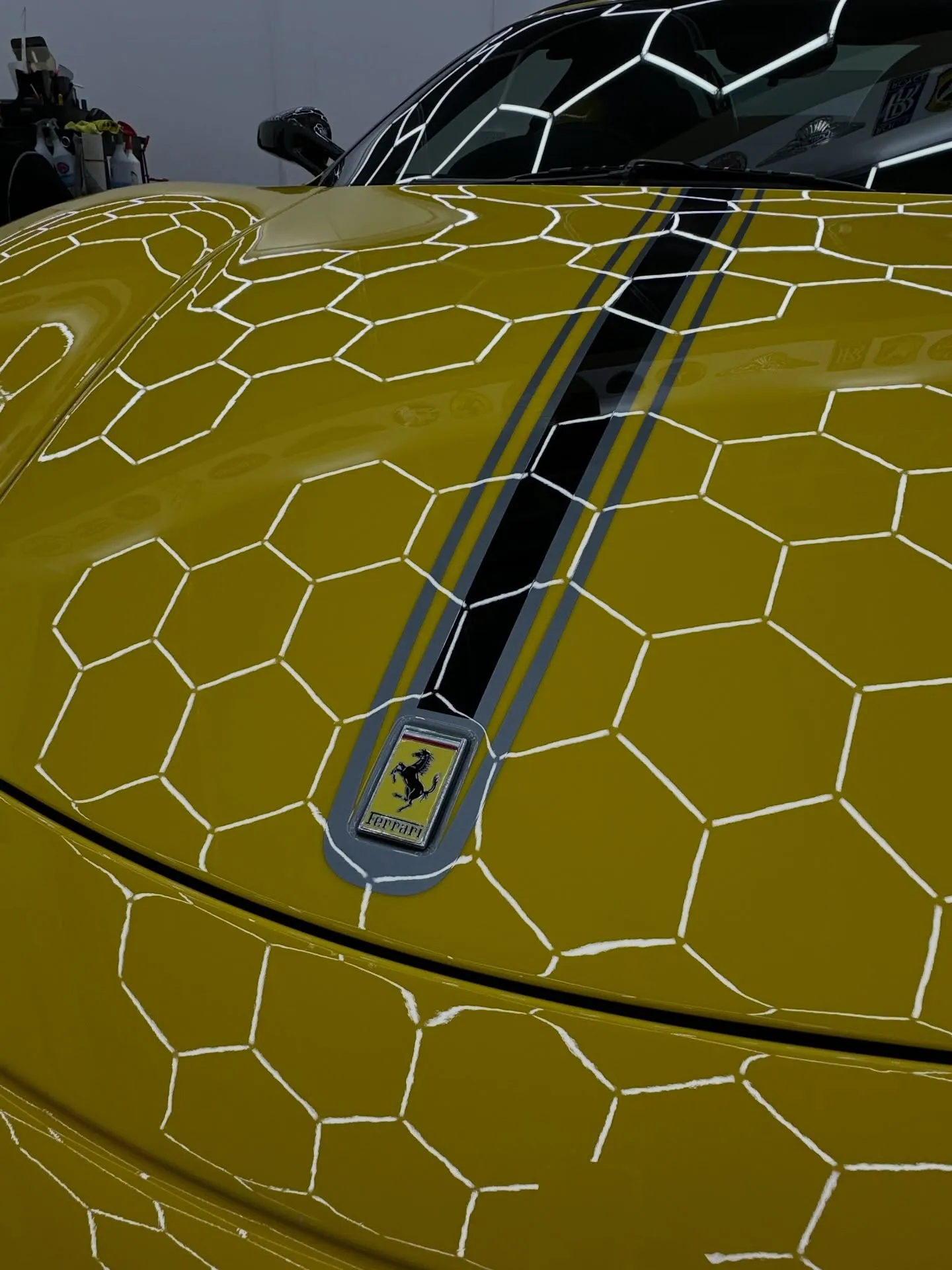 Close up of of badge on yellow Ferrari
